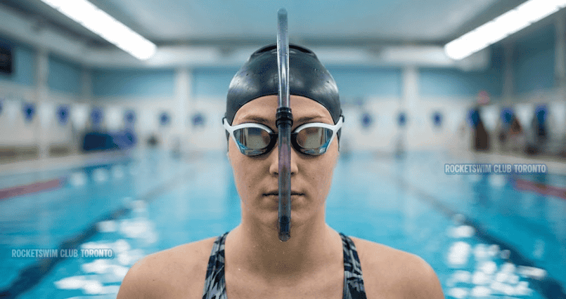 Swimmer wearing center mount swim snorkel correctly